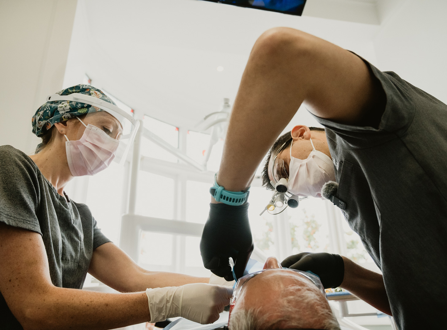 Dr Daniel Hargitai and a dental nurse treating a patient at Bespoke Dental, Malahide