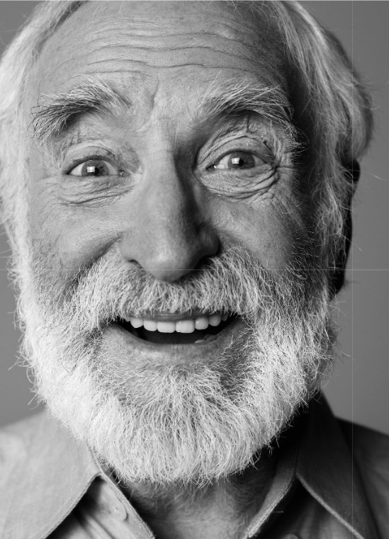Smiling older man with a full, natural smile